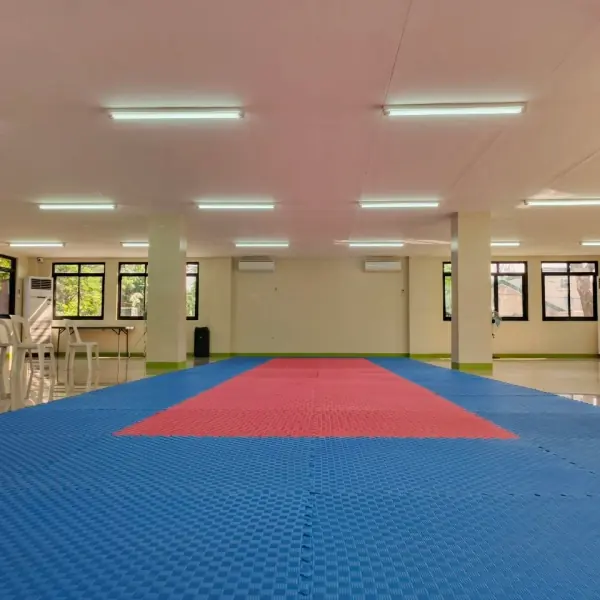 The training hall matted out in blue and red, ready for class