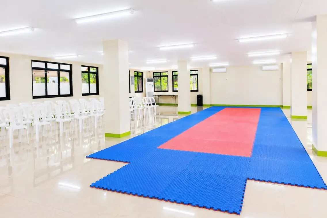 The full training floor with seating along one side for watching parents